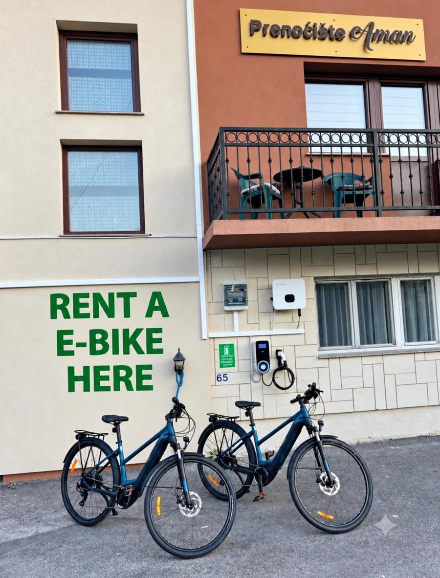 The electric bicycles and rental sign outside Prenoćište Aman